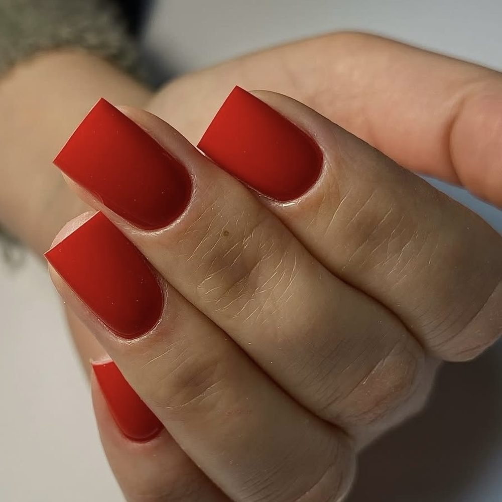 Square nails in a deep brick red
