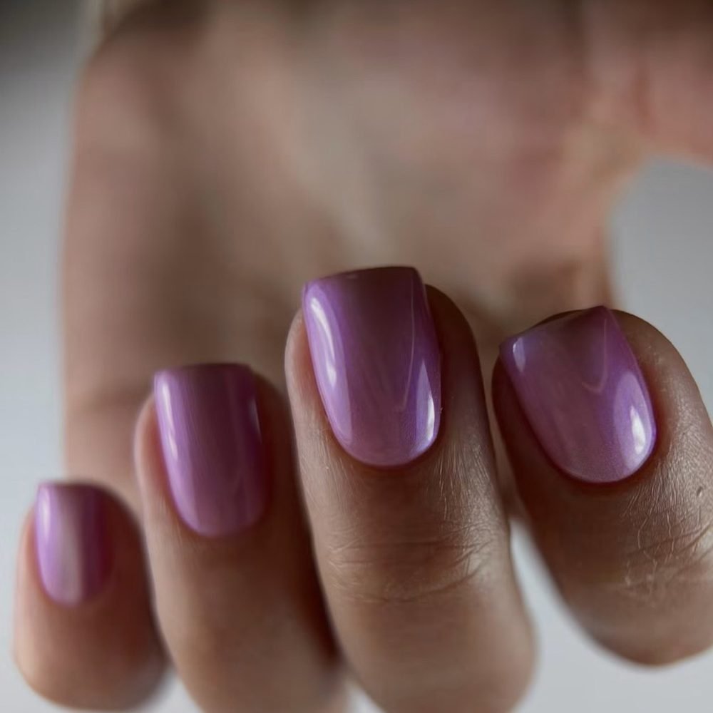 Short square nails in a glossy plum chrome