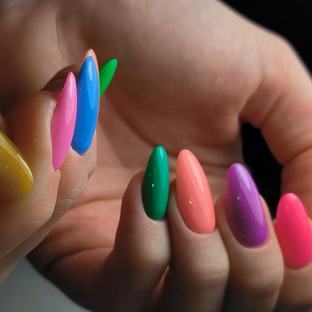 Ten almond nails, each in a different bright colour